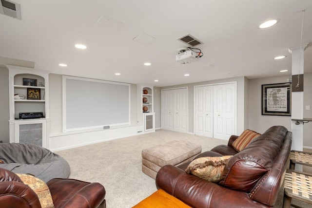 50550 W Fellows Creek Ct, Plymouth, MI 48170 - carpeted cinema room featuring built in shelves and recessed lighting