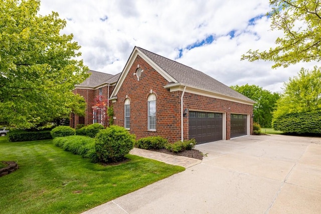50550 W Fellows Creek Ct, Plymouth, MI 48170 - view of side of home featuring brick siding, a lawn, a shingled roof, and driveway