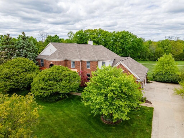 50550 W Fellows Creek Ct, Plymouth, MI 48170 - view of front of home featuring a front lawn, a chimney, concrete driveway, and brick siding