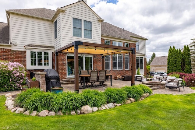 50550 W Fellows Creek Ct, Plymouth, MI 48170 - back of property with brick siding, a patio area, a yard, an outdoor living space with a fire pit, and a shingled roof