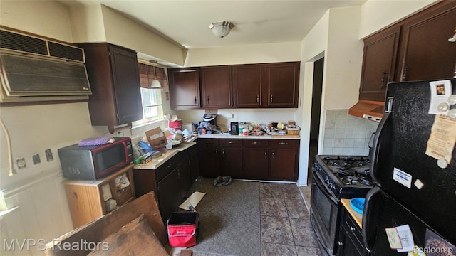 29699 Brown Ct, Garden City, MI 48135 - kitchen featuring freestanding refrigerator, range with gas stovetop, light countertops, stainless steel microwave, and tasteful backsplash