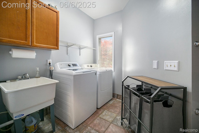 13135 Eagle Ct, South Lyon, MI 48178 - laundry area featuring cabinet space, washing machine and dryer, and light stone finish floors