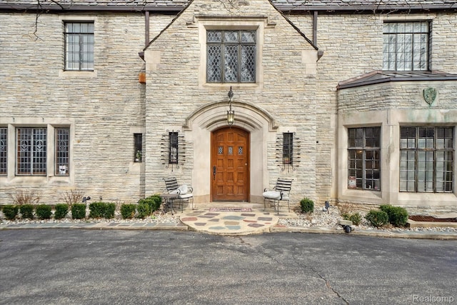925 Avon St, Flint, MI 48503 - doorway to property with stone siding
