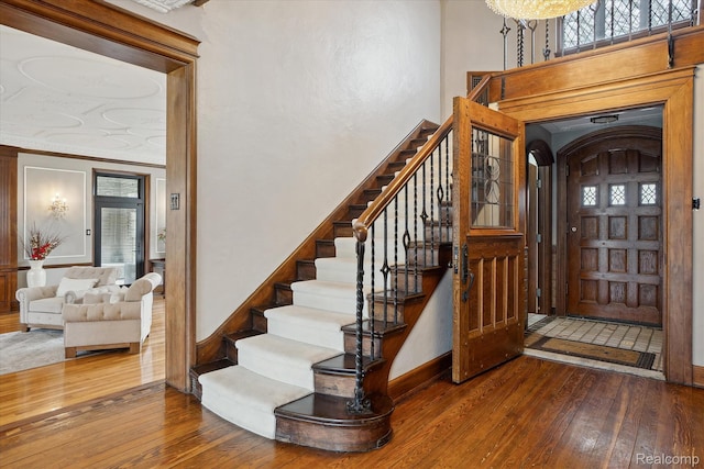 925 Avon St, Flint, MI 48503 - entryway with hardwood / wood-style floors, stairway, and baseboards