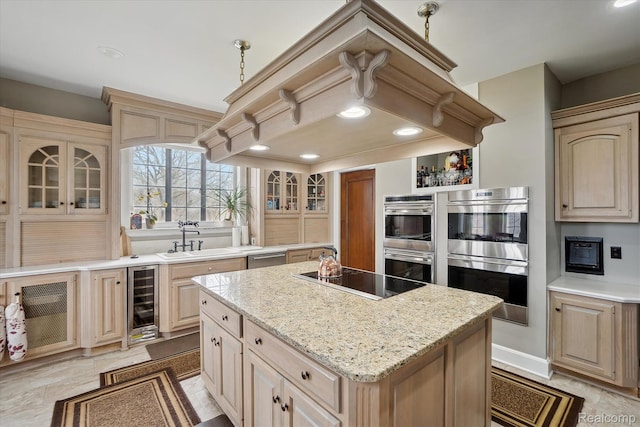 925 Avon St, Flint, MI 48503 - kitchen featuring stainless steel double oven, black electric cooktop, beverage cooler, a kitchen island, and recessed lighting