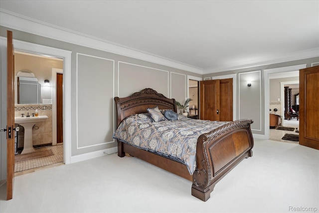 925 Avon St, Flint, MI 48503 - carpeted bedroom with crown molding, connected bathroom, and a decorative wall