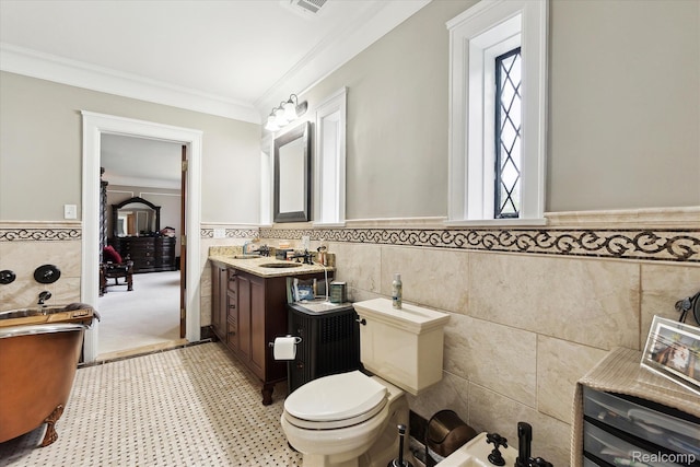 925 Avon St, Flint, MI 48503 - bathroom with tile walls, a wainscoted wall, crown molding, vanity, and a bidet