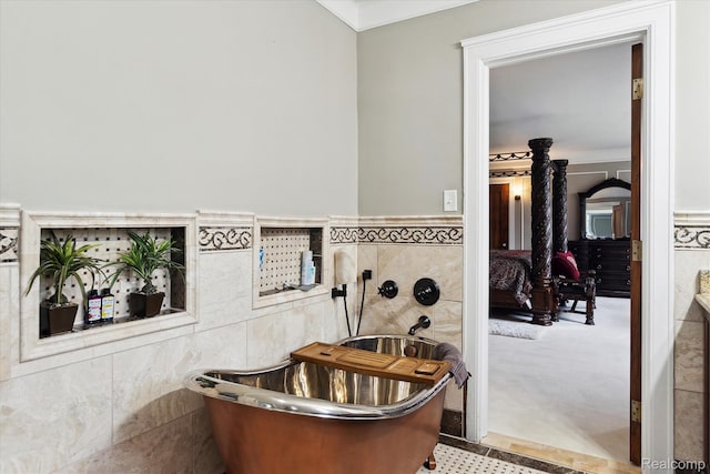 925 Avon St, Flint, MI 48503 - full bath featuring tile walls, a freestanding tub, wainscoting, and ornamental molding