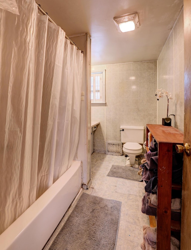 13 W 17th St, Holland, MI 49423 - full bath with toilet, shower / tub combo with curtain, tile walls, and tile patterned flooring