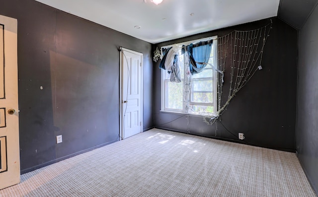 13 W 17th St, Holland, MI 49423 - empty room featuring carpet and vaulted ceiling