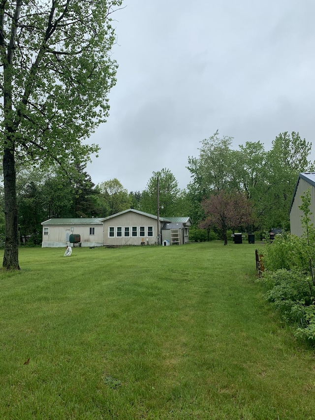 5501 Egner St NE, Cedar Springs, MI 49319 - view of green lawn featuring view of scattered trees