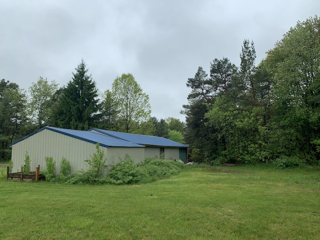 5501 Egner St NE, Cedar Springs, MI 49319 - view of grassy yard with an outbuilding