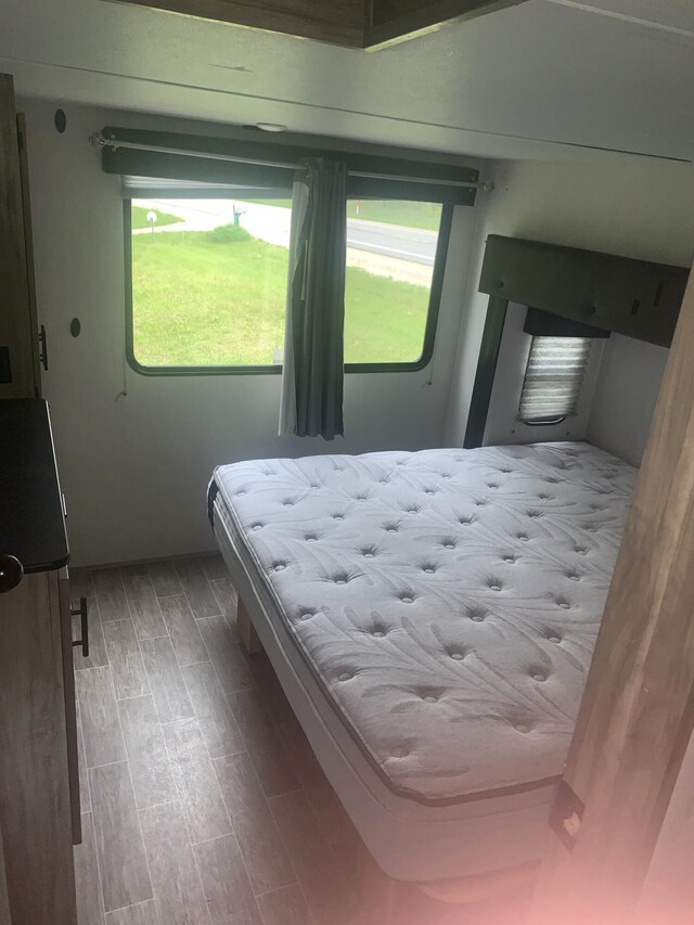 5501 Egner St NE, Cedar Springs, MI 49319 - bedroom featuring wood finished floors