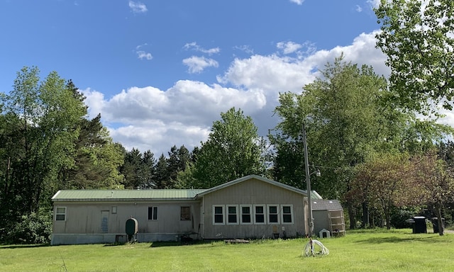 5501 Egner St NE, Cedar Springs, MI 49319 - back of house featuring a lawn