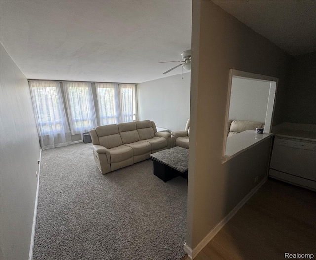 22700 Garrison St Unit 501, Dearborn, MI 48124 - living room with a ceiling fan, dark colored carpet, and baseboards