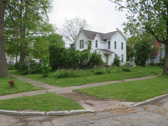 236 S Jeffery Ave, Ithaca, MI 48847 - view of property exterior with roof with shingles and a yard