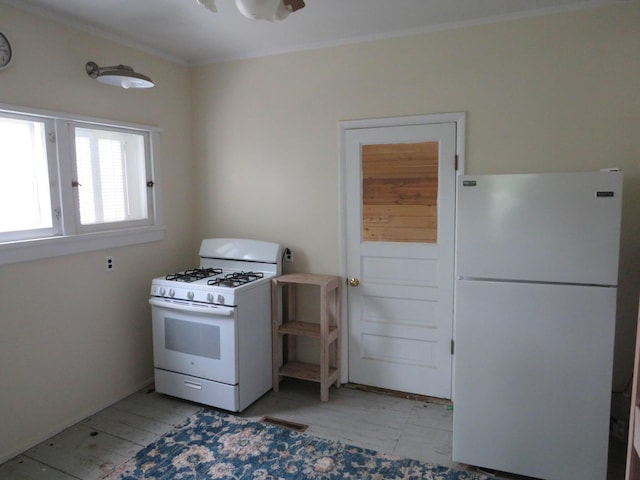 236 S Jeffery Ave, Ithaca, MI 48847 - kitchen featuring white appliances and ornamental molding