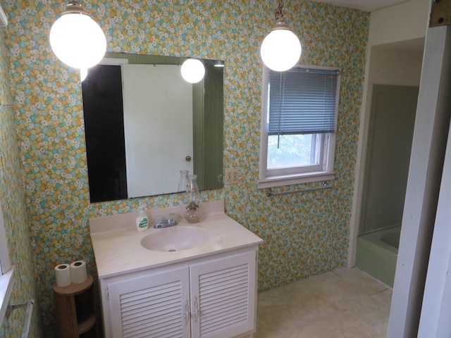 236 S Jeffery Ave, Ithaca, MI 48847 - bathroom with vanity, wallpapered walls, and tile patterned floors
