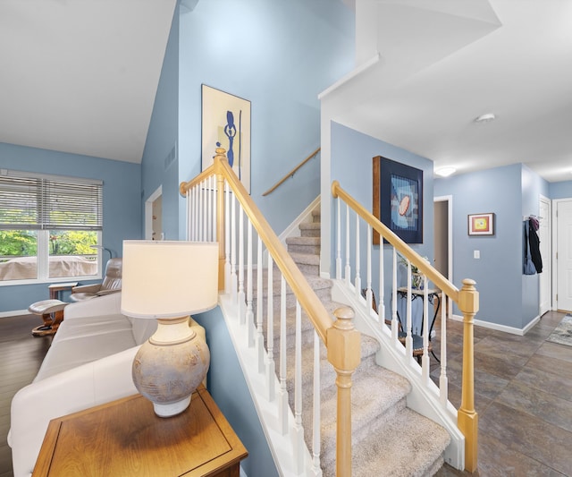702 Starfield Dr, Pinckney, MI 48169 - stairs featuring baseboards