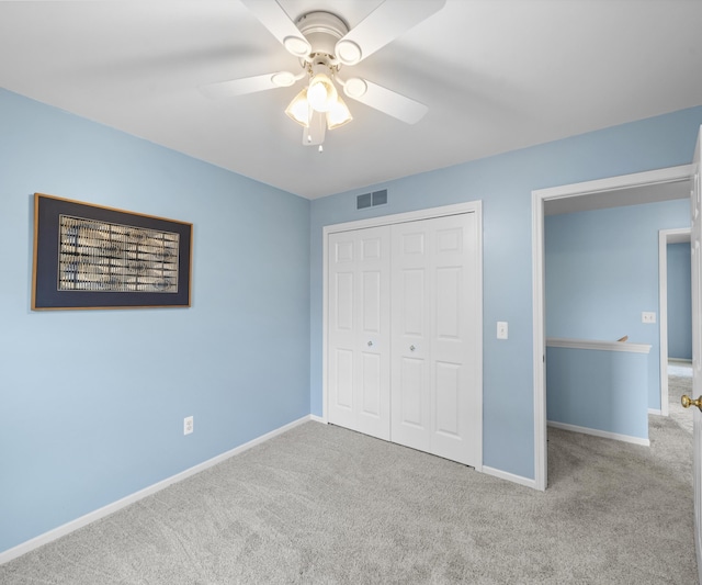 702 Starfield Dr, Pinckney, MI 48169 - unfurnished bedroom with carpet floors, baseboards, a closet, and ceiling fan