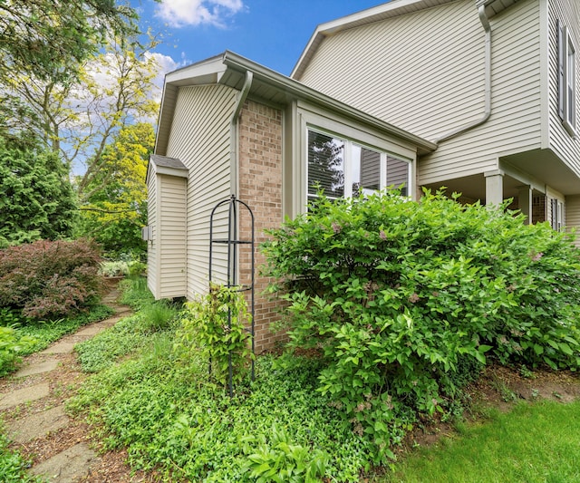 702 Starfield Dr, Pinckney, MI 48169 - view of home's exterior featuring brick siding