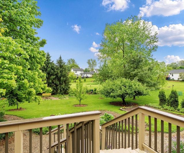 702 Starfield Dr, Pinckney, MI 48169 - wooden deck with a lawn
