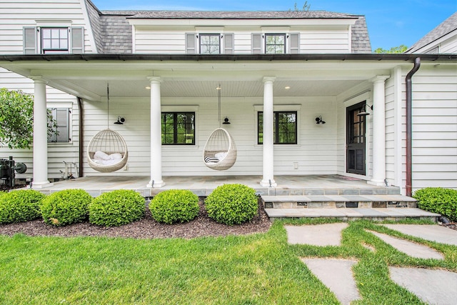 310 Lakeside Dr SE, East Grand Rapids, MI 49506 - view of front of home with covered porch and roof with shingles