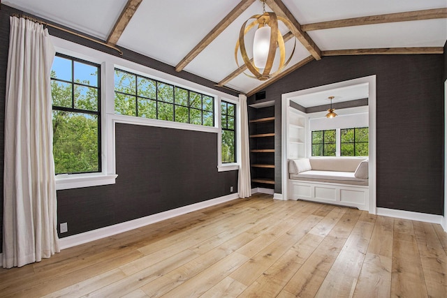 310 Lakeside Dr SE, East Grand Rapids, MI 49506 - spare room featuring light wood finished floors, baseboards, and built in features