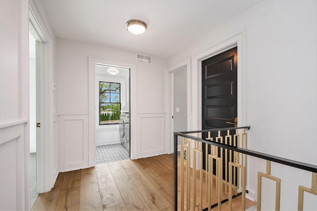 310 Lakeside Dr SE, East Grand Rapids, MI 49506 - foyer entrance with light wood-style floors
