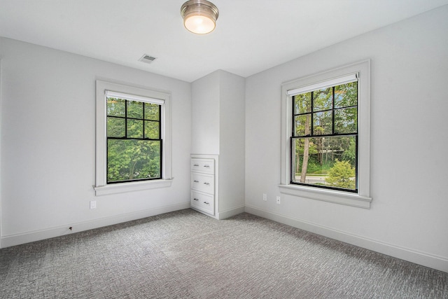 310 Lakeside Dr SE, East Grand Rapids, MI 49506 - unfurnished room featuring healthy amount of natural light and baseboards