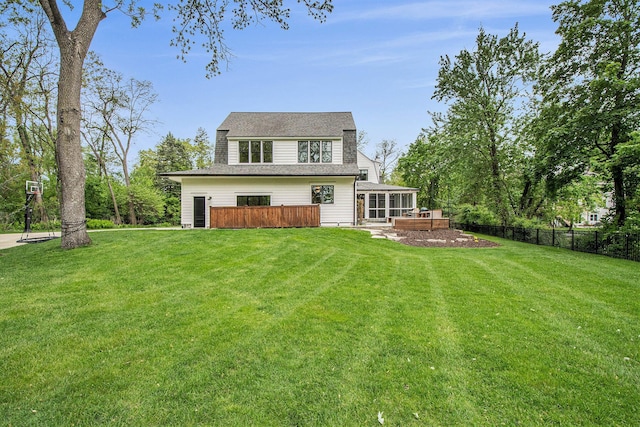 310 Lakeside Dr SE, East Grand Rapids, MI 49506 - back of house with a sunroom