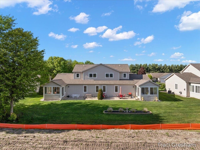1733 Grevel Ct, Muskegon, MI 49444 - back of house featuring a sunroom, a patio, and a yard