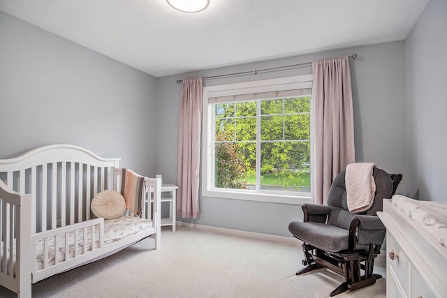 3724 Charlevoix Dr SE, Grand Rapids, MI 49546 - carpeted bedroom with baseboards and a crib