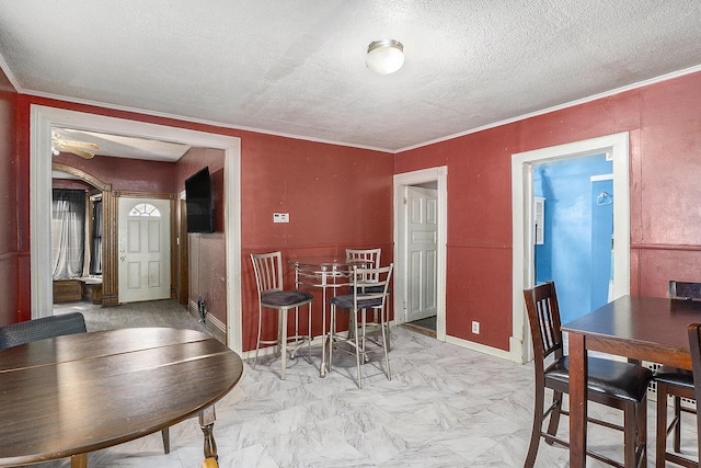 706 N Linn St, Bay City, MI 48706 - dining space featuring ornamental molding, a textured ceiling, and baseboards