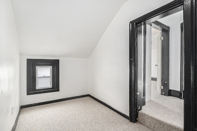 706 N Linn St, Bay City, MI 48706 - bonus room featuring carpet floors, lofted ceiling, and baseboards