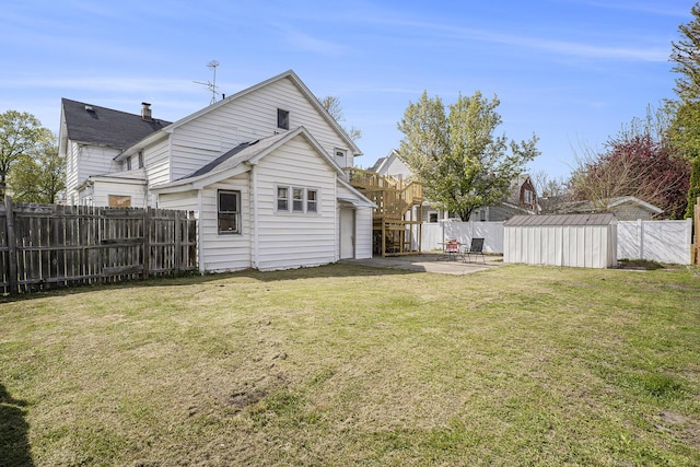 706 N Linn St, Bay City, MI 48706 - rear view of property featuring a patio, a chimney, and a shingled roof