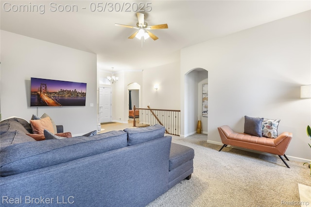 4428 Cross Creek Blvd, Burton, MI 48509 - living area with arched walkways, a ceiling fan, light colored carpet, and baseboards