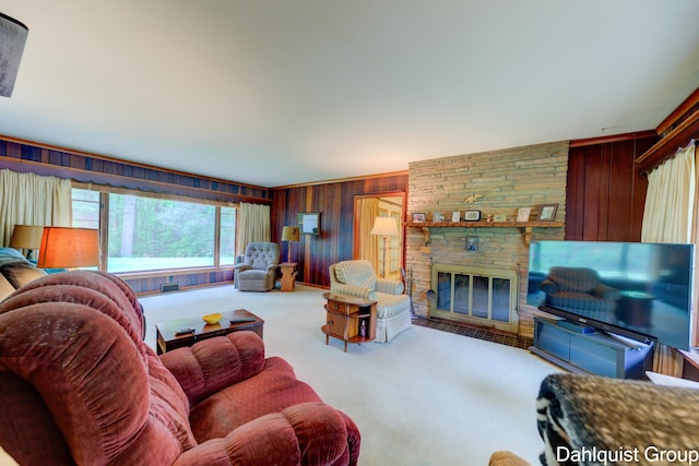 2587 Pennsylvania Ave, Muskegon, MI 49445 - carpeted living room with wood walls and a fireplace
