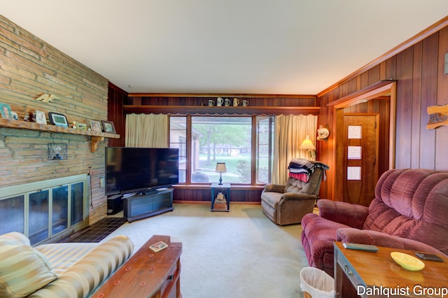 2587 Pennsylvania Ave, Muskegon, MI 49445 - living room with carpet, wooden walls, and a large fireplace