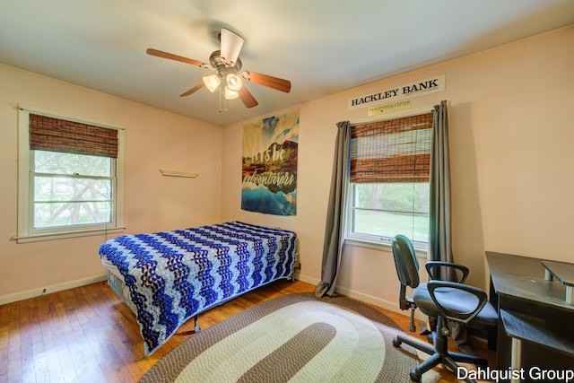 2587 Pennsylvania Ave, Muskegon, MI 49445 - bedroom featuring wood finished floors, baseboards, and ceiling fan