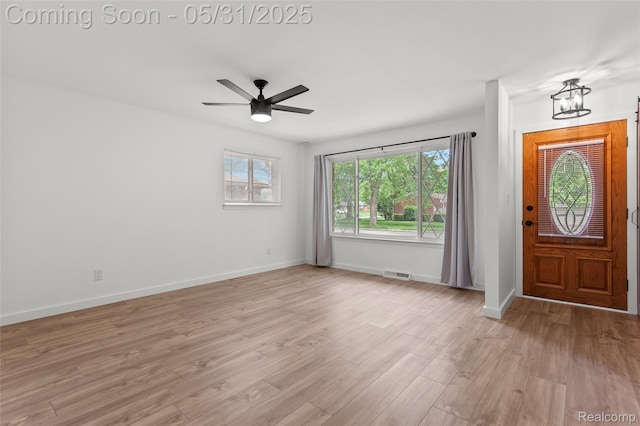 27677 Doreen St, Farmington Hills, MI 48336 - entryway featuring light wood-style floors, baseboards, ceiling fan, and a chandelier