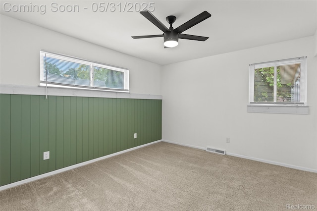 27677 Doreen St, Farmington Hills, MI 48336 - spare room featuring wainscoting, a ceiling fan, carpet, and wooden walls