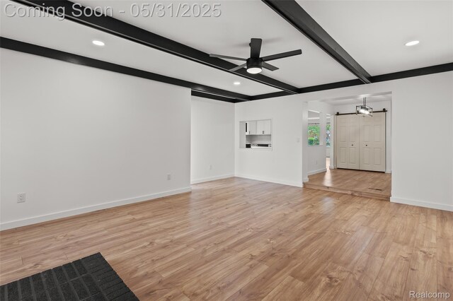 27677 Doreen St, Farmington Hills, MI 48336 - unfurnished living room featuring a ceiling fan, baseboards, light wood-style floors, beam ceiling, and a barn door