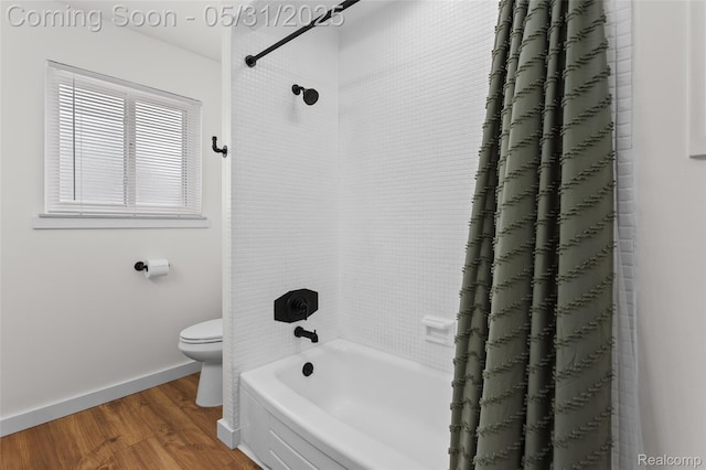 27677 Doreen St, Farmington Hills, MI 48336 - bathroom featuring toilet, wood finished floors, shower / tub combo with curtain, and baseboards