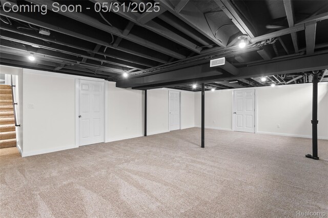 27677 Doreen St, Farmington Hills, MI 48336 - finished below grade area featuring stairway, carpet, and baseboards