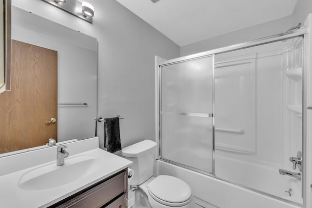 2840 Bombridge Ct, Ann Arbor, MI 48104 - full bathroom with vanity, toilet, and bath / shower combo with glass door