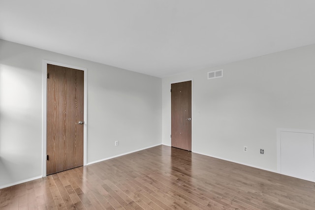 2840 Bombridge Ct, Ann Arbor, MI 48104 - spare room featuring wood finished floors and baseboards