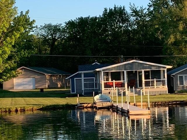 996 Lakeview Dr, Brooklyn, MI 49230 - dock area featuring a water view and a lawn