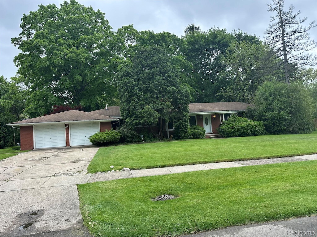 19041 Bungalow Dr, Lathrup Village, MI 48076 - view of front of property with a front yard and driveway