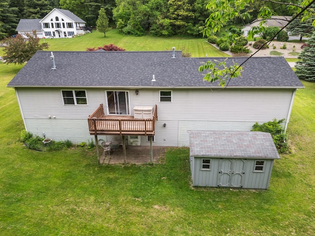 2041 Blackmer Dr, Jonesville, MI 49250 - back of house featuring a deck, a yard, and roof with shingles